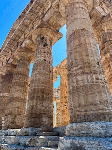 Low Angle, Close-Up View of Ancient Greek Columns at the Hera Temple in Paestum, Italy