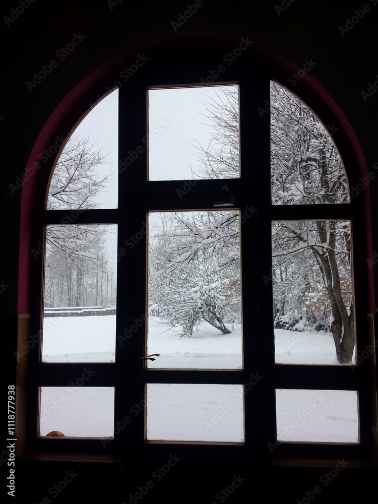 View from a window of a snow-covered landscape. vertical photo View from a window of a snow-covered landscape. vertical photo