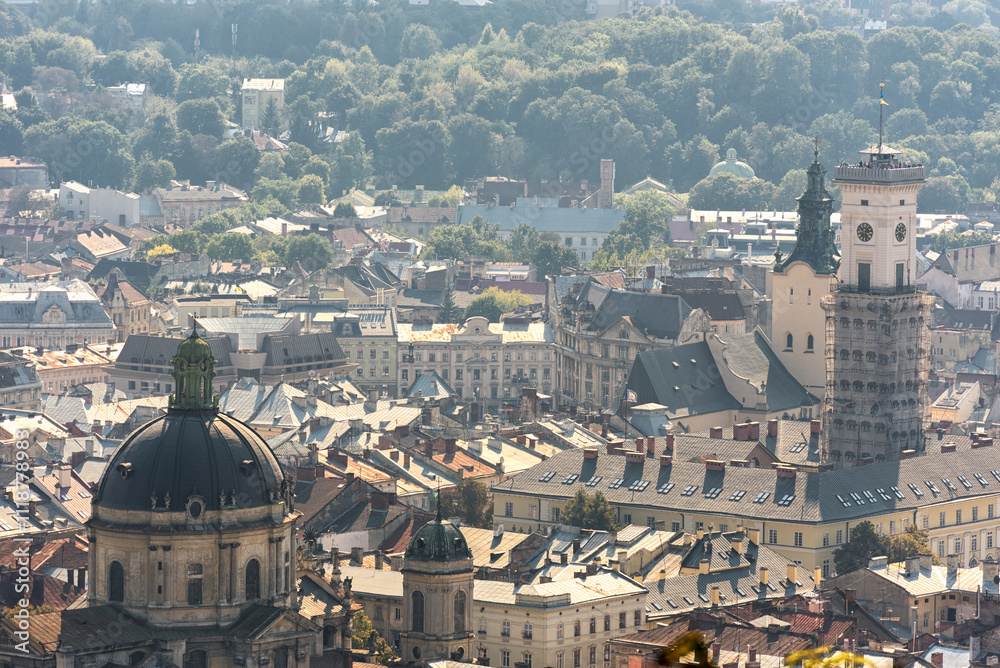 Fototapeta premium Lviv Cityscape. Ukraine. Lviv Old Town. City Hall Tower and Clock in background