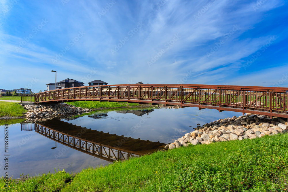 A bridge over a river with a reflection of the bridge in the water A bridge over a river with a reflection of the bridge in the water