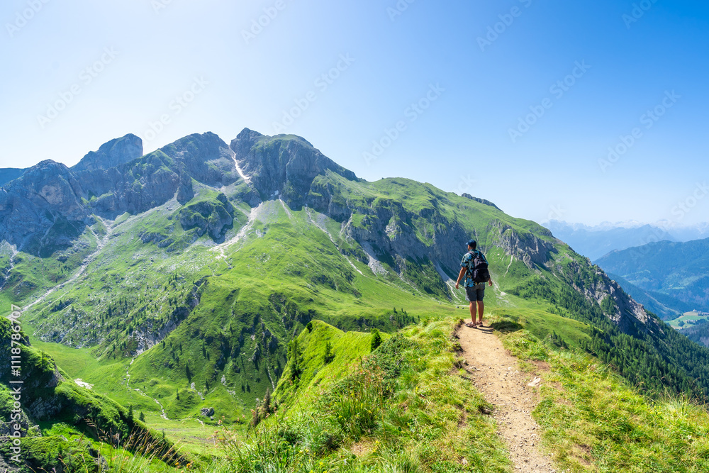 Tourist hiking along the scenic trails of the giau pass in the italian dolomites Tourist hiking along the scenic trails of the giau pass in the italian dolomites