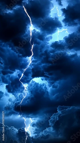 Dark storm clouds illuminated by flashes of lightning during a thunderstorm at night