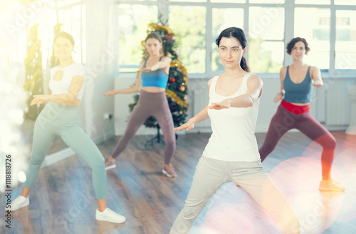 Group of women dancing energetic modern dance in studio