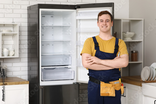 Happy male worker of repair...