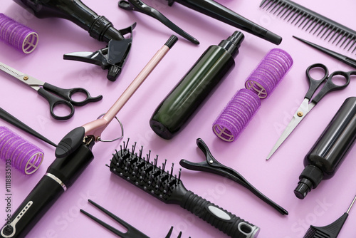 Set of hairdresser's accessories on pink background, closeup