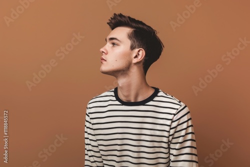 Wallpaper Mural Stylish male with long dark hair looking upward in a neutral expression. Torontodigital.ca