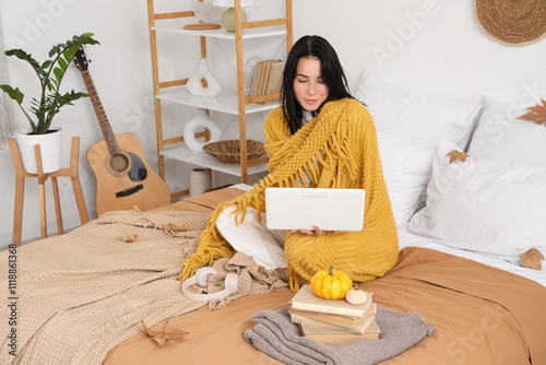 Young happy woman with warm...