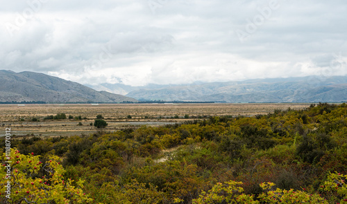 Beautiful new zealand mackenzie twizel landscape mountains hills clouds photo