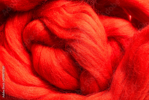 Texture of red wool for felting as background, closeup photo