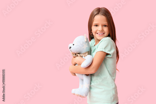 Happy little girl with tedd...