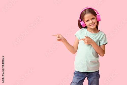 Happy little girl in headph...