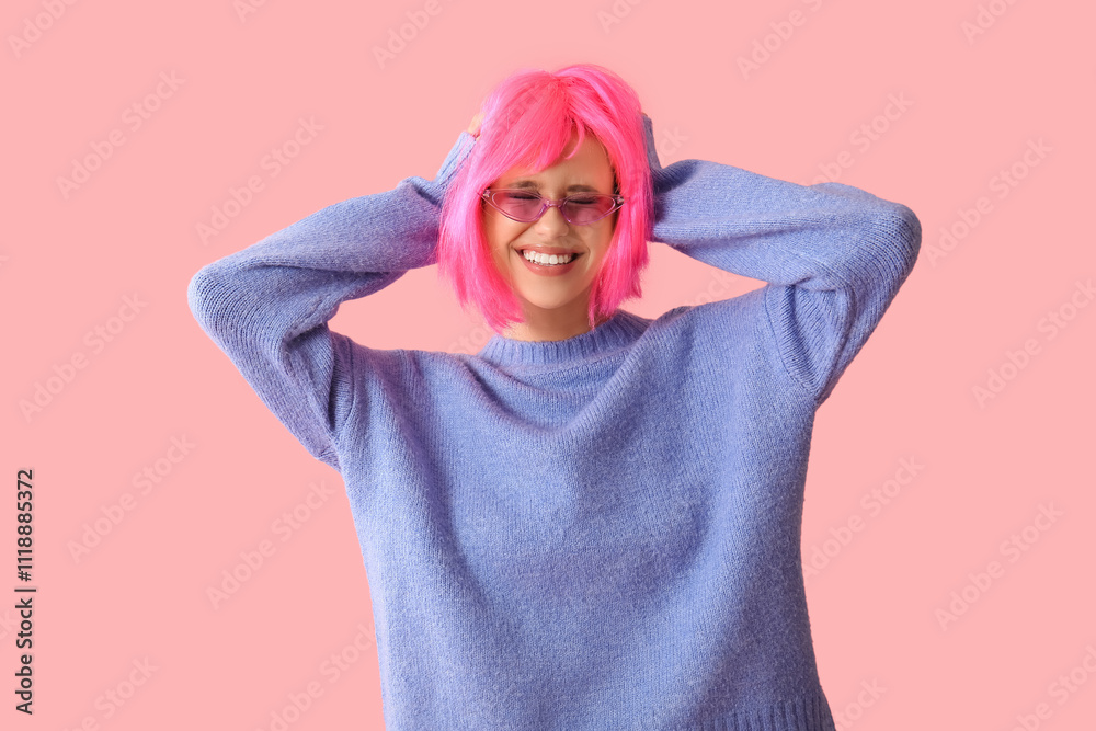 Beautiful young woman in pink wig and stylish sunglasses on color background Beautiful young woman in pink wig and stylish sunglasses on color background