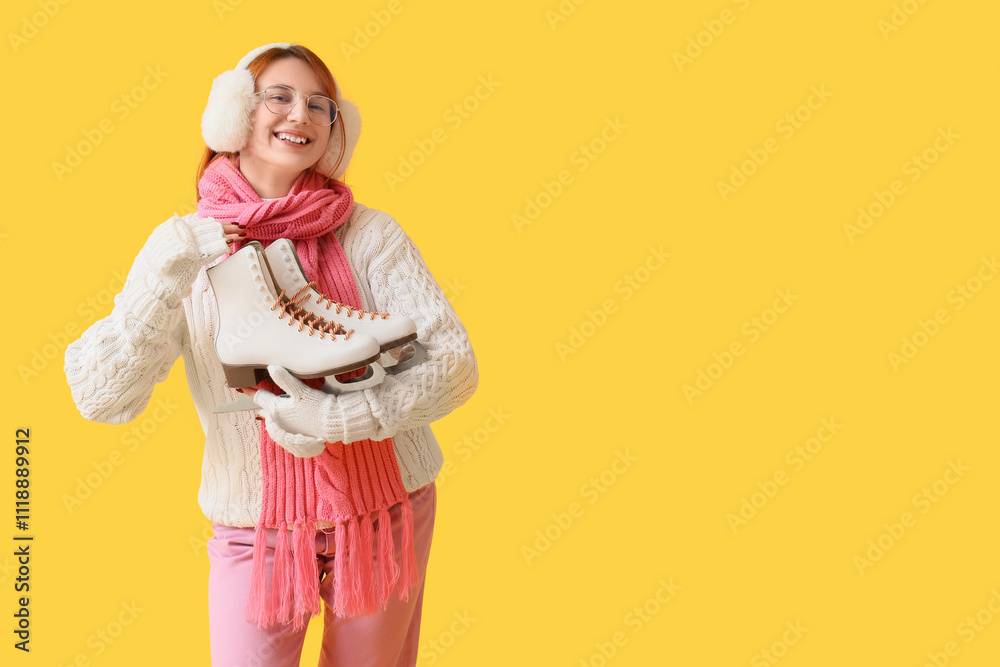 Beautiful young happy woman with ice skates on yellow background Beautiful young happy woman with ice skates on yellow background