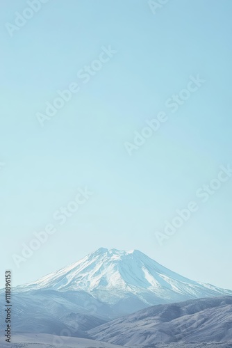 A serene mountain landscape under a clear blue sky.