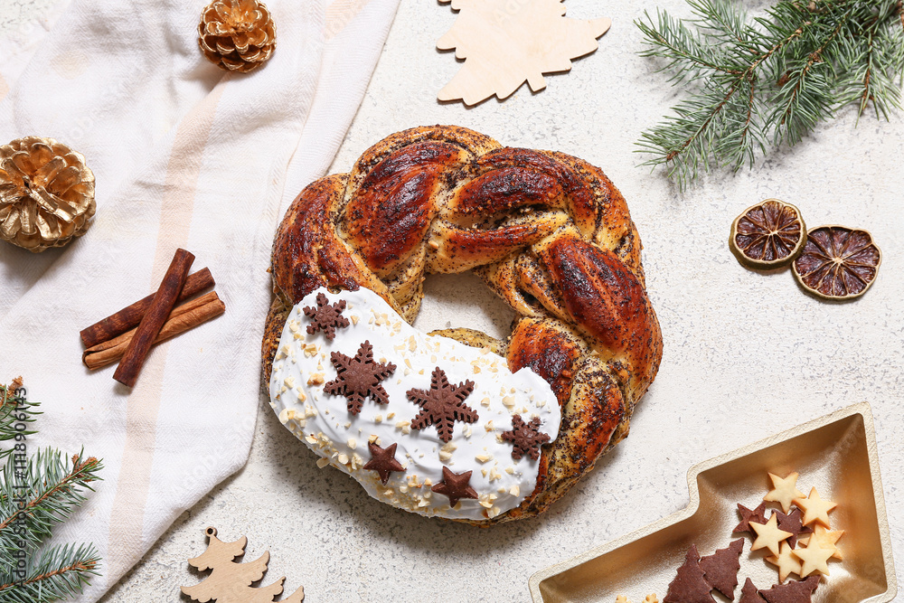 Fototapeta premium Tasty Christmas pastry wreath with fir tree branches, decor and cookies on white background