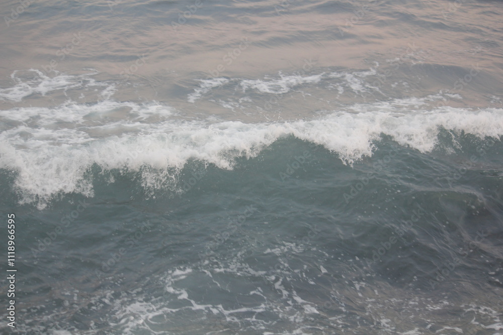 Fototapeta premium Image of waves crashing on Imrang Beach in Busan, Korea 