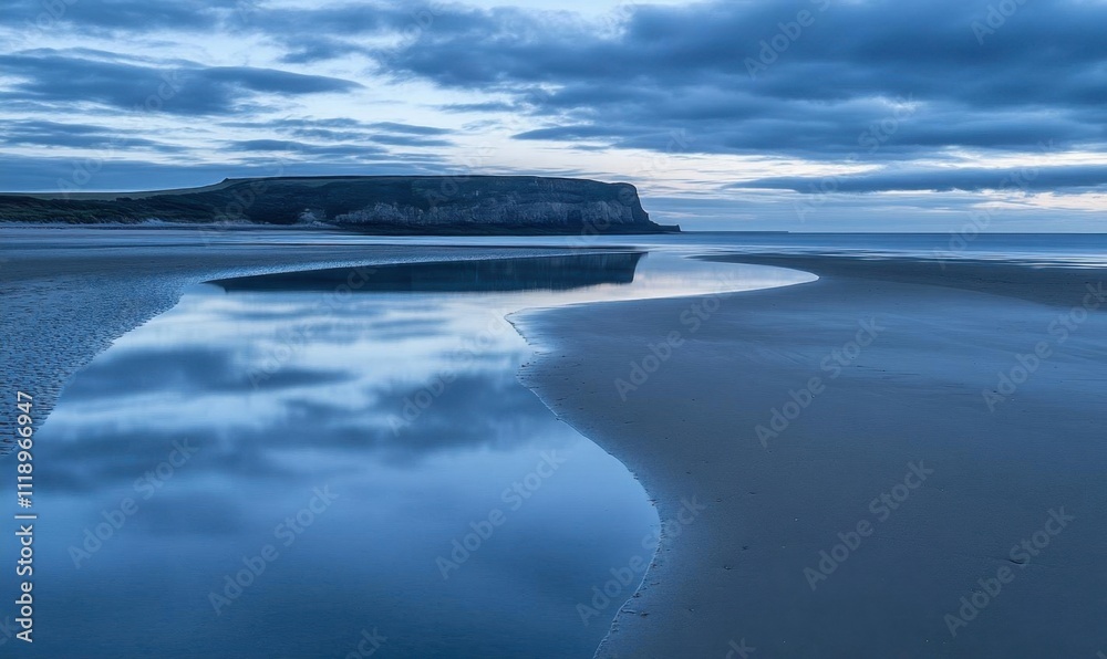 Tranquil coastal scene during twilight with reflective water. Tranquil coastal scene during twilight with reflective water.