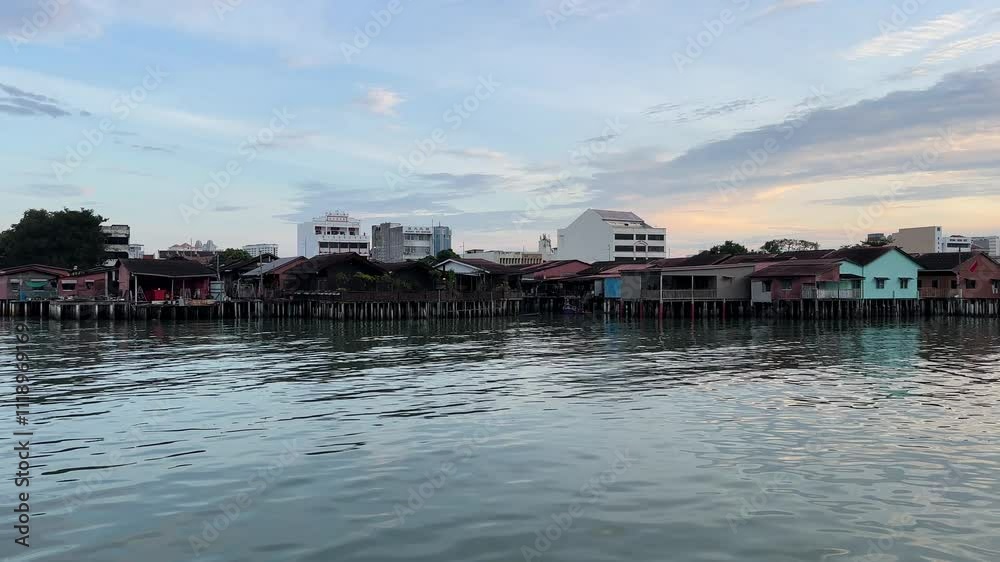 Serene morning scene of wooden floating village in Penang. Clan Jetty in Penang. Rustic living condition. Serene morning scene of wooden floating village in Penang. Clan Jetty in Penang. Rustic living condition.