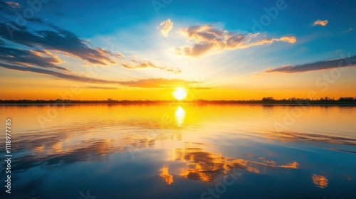 A serene sunset over a calm lake with vibrant colors reflecting.