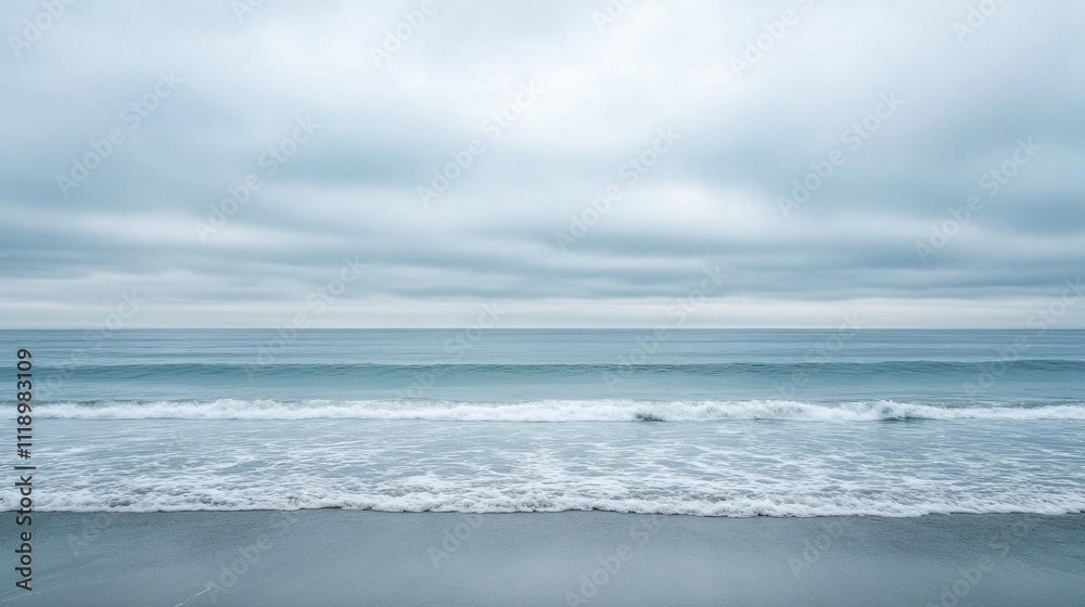 A serene coastal scene with gentle waves and overcast skies. A serene coastal scene with gentle waves and overcast skies.