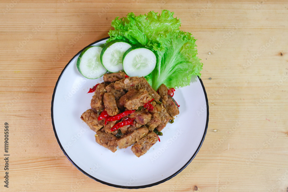 Tempe orek is a traditional Javanese Indonesian dish, served with rice as a side dish for breakfast, lunch or dinner Tempe orek is a traditional Javanese Indonesian dish, served with rice as a side dish for breakfast, lunch or dinner