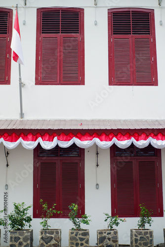 unique and antique red windows from old buildings photo