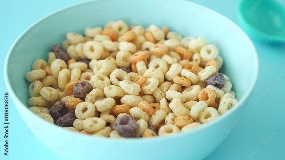 A Bowl Full of Colorful RingShaped Breakfast Cereal Ready to Be Enjoyed with Milk A Bowl Full of Colorful RingShaped Breakfast Cereal Ready to Be Enjoyed with Milk