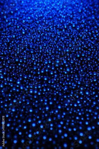 a close up of a blue background with small bubbles