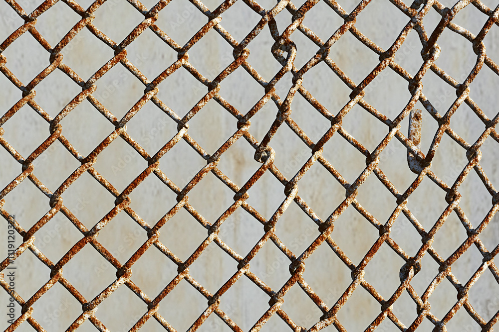 Rusty Chain Link Fence Texture: A close-up shot of a weathered chain-link fence, revealing the intricate details of rust-stained metal mesh. This gritty texture offers a raw and industrial aesthetic. Rusty Chain Link Fence Texture: A close-up shot of a weathered chain-link fence, revealing the intricate details of rust-stained metal mesh. This gritty texture offers a raw and industrial aesthetic.