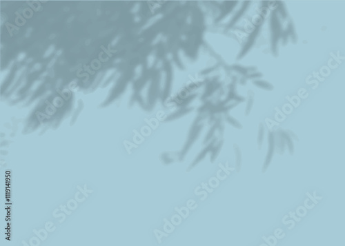 The shadow of many tree leaves on a blue wall. Black and white image for photo overlay or mockup