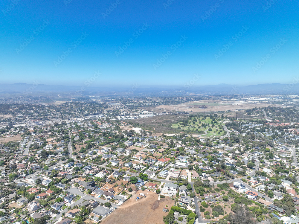 Aerial view of middle class houses in the valley of Oceanside town in San Diego, California. USA. Aerial view of middle class houses in the valley of Oceanside town in San Diego, California. USA.