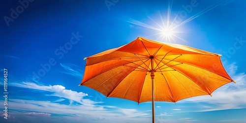 A bright orange beach umbrella casting a shadow on a sunny day with a bright blue sky and fluffy white clouds