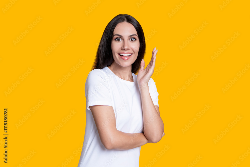 Amazed young woman with brunette hair. Stylish female. Female casual style. Portrait of millennial girl. Caucasian millennial girl. Woman in white tshirt isolated on yellow. Independent mindset Amazed young woman with brunette hair. Stylish female. Female casual style. Portrait of millennial girl. Caucasian millennial girl. Woman in white tshirt isolated on yellow. Independent mindset
