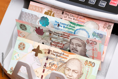 Bahamian dollar in the counting machine photo