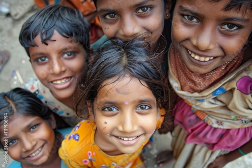 Group of indian kids smiling and looking at the camera in India