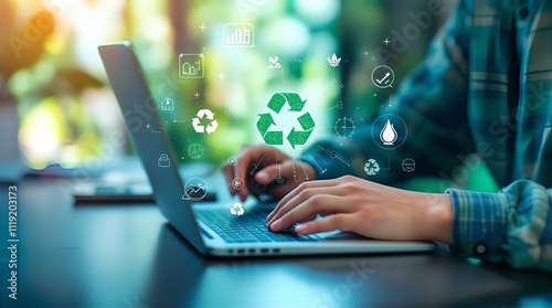 Person working on laptop with digital overlay of recycling and sustainability icons, signifying eco-conscious business practices.