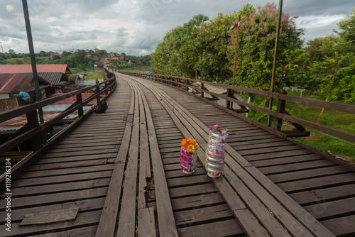 Uttamanusorn Bridge commonly known as Wooden Mon Bridge is famous that the longest wooden bridge in Thailand located in Sangkla Buri, Kanchanaburi. photo