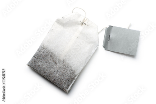 Tea bag with string label on white background. Dry bag of black tea with shade.