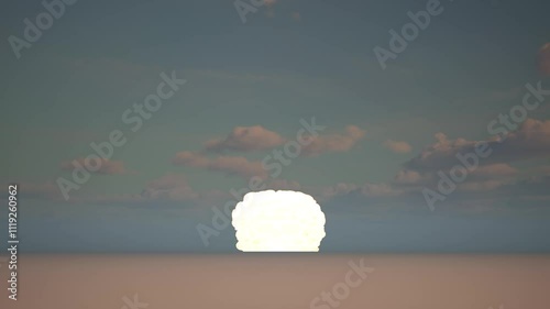 Epic bright flash of fiery explosion followed by smoke rising into the sky.