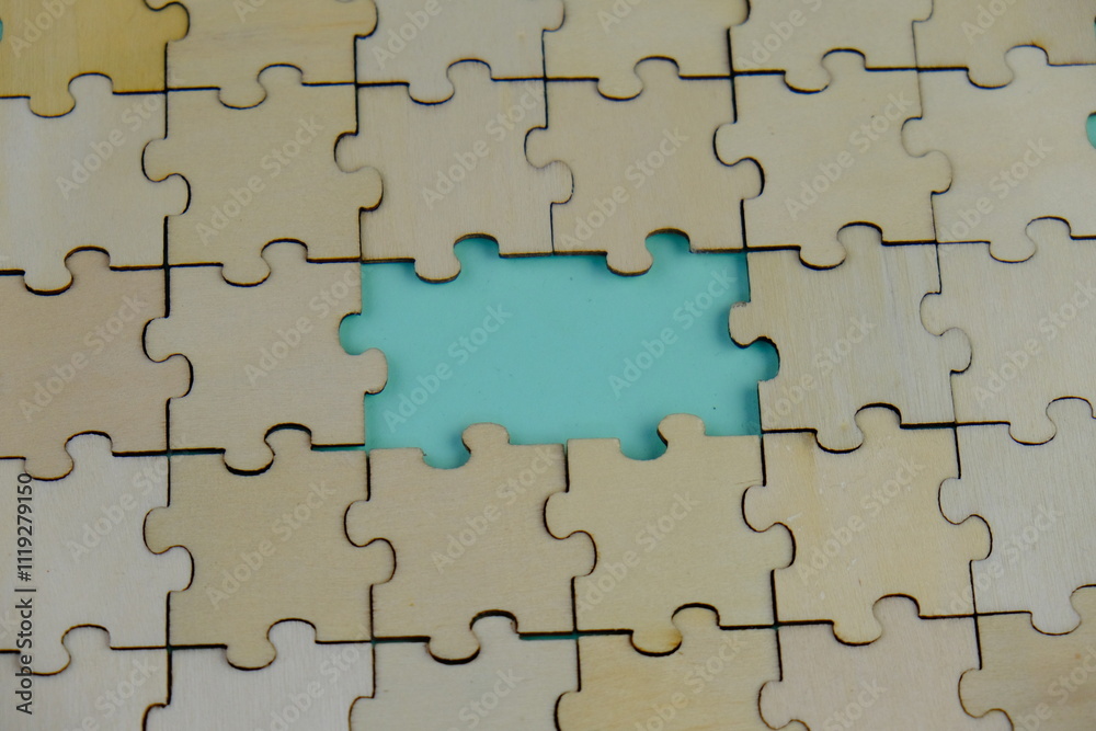 text space of wooden puzzle on green background