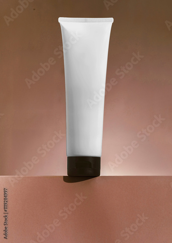 Plastic cosmetic tube for cream or gel mockup on brown mocha background