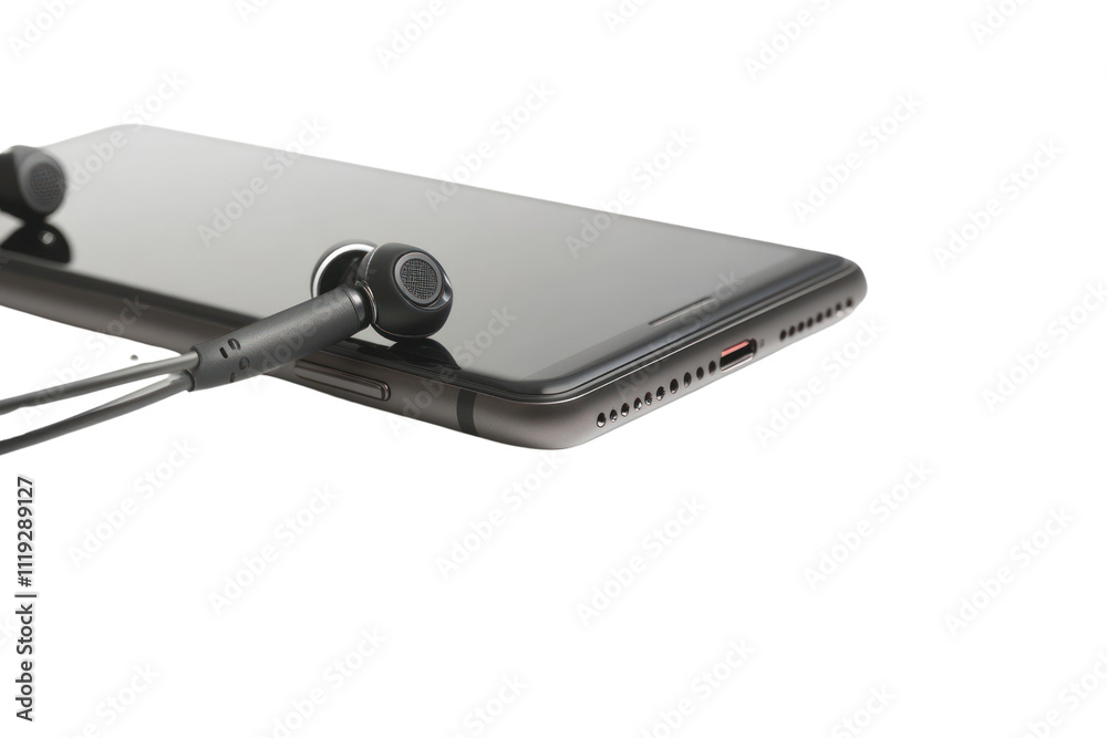 Smartphone Audio: Closeup of sleek black earphones plugged into a smartphone, symbolizing seamless connectivity and high-quality sound. Smartphone Audio: Closeup of sleek black earphones plugged into a smartphone, symbolizing seamless connectivity and high-quality sound.