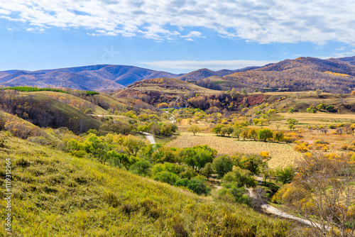 Beautiful grassland and forest with mountains natural landscape in Inner Mongolia, China. Autumn scenery.