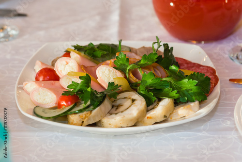 Cold meat snack food. A dish on the festive table.