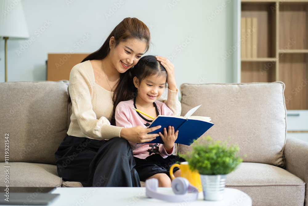 Mother and daughter spend their holiday in the living room at home, daughter kissing happy mother. Mother and daughter spend their holiday in the living room at home, daughter kissing happy mother.