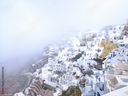 beautiful morning fog on the base of Santorini in Greece in the village of Oia
