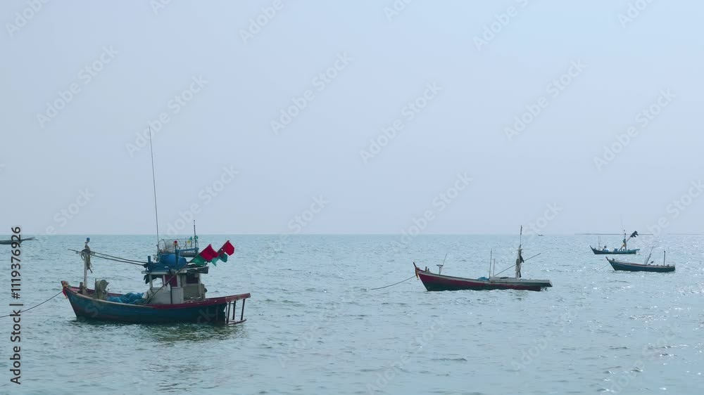 group of fisherman's fishing boat is moored near the shore. After going out to hunt fish at night and brought back to sell in the early morning. group of fisherman's fishing boat is moored near the shore. After going out to hunt fish at night and brought back to sell in the early morning.