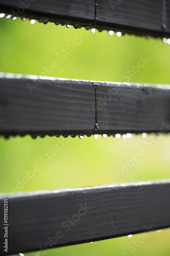 Dew drops on wooden slats very close up photo