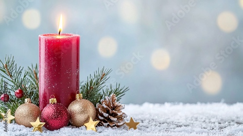 Christmas tree idea creativity concept. Red candle surrounded by festive decorations on a snowy surface, creating a cozy holiday atmosphere.