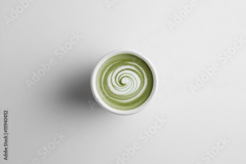 Creamy Green Tea Latte with Spiral Foam Design on White Background